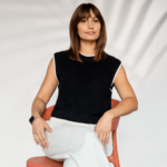 Picture of Chloé Lorini sitting in an orange chair.